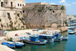 Gallipoli, Apulia - Angevin castle with fishing boats Gallipoli, Apulia - Angevin castle with fishing boats
