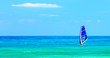 Panoramic beach landscape with windsurfer playing