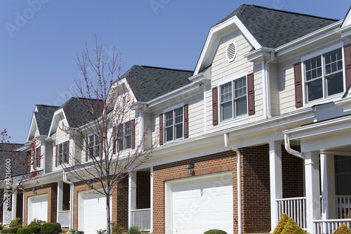 Photo: Row of townhouses in early springtime Row of townhouses in early springtime
