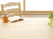 Cup book and plant on wooden table