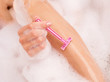 woman shaving legs