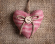 Heart with button on on brown sacking Heart with button on on brown sacking