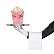 A waiter holding a silver tray with popcorn box on it A waiter holding a silver tray with popcorn box on it
