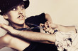 woman in a black hat and painted  mustache