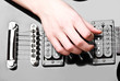 Close up of an electric guitar being played