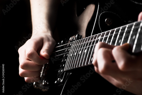 Photo: Electric guitar being played Electric guitar being played