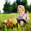little boy with a basket of fruit