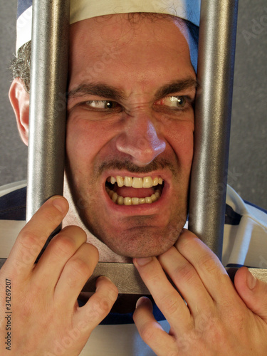 Photo: Prisionero en una prisión. Prisionero en una prisión.