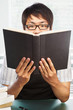 Photo: Chinese college male student holding book Chinese college male student holding book