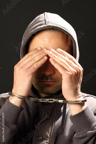 Photo: man with handcuffs man with handcuffs
