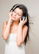 Brunette immersed in music wearing headphones.