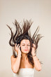 Brunette immersed in music wearing headphones.