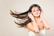 Brunette immersed in music wearing headphones.