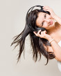 Beautiful brunette enjoying music.