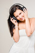 Beautiful brunette enjoying music.