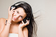Beautiful brunette enjoying music.