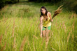 woman enjoying picking wild flowers in a green field. woman enjoying picking wild flowers in a green field.