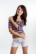 Portrait of a happy young woman smiling against white background Portrait of a happy young woman smiling against white background