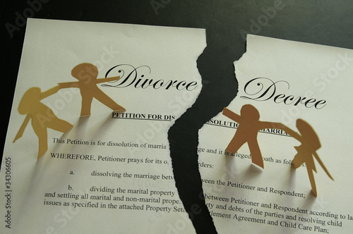 Photo: divorce decree document and paper family figures divorce decree document and paper family figures
