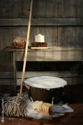 Photo: Old wash bucket with mop and brushes Old wash bucket with mop and brushes