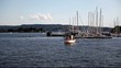 Boat at makefast in Oslo fjord with marina behind Full HD