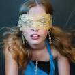 beautiful girl with a long curly hair shows jewelry