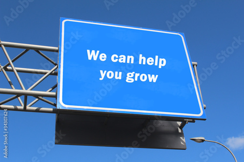 Photo: We can help you grow - Highway sign We can help you grow - Highway sign