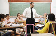 Teacher with children in classroom, boys and girls in school