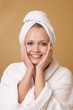 Happy Woman Getting Beauty Treatment Wearing Towel