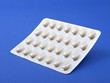 HRT - Hormone replacement therapy tablets, on purple HRT - Hormone replacement therapy tablets, on purple