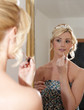 Brides reflection in mirror on her wedding day