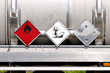 Container for liquid fuel and oil transport with warning plates