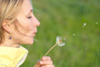 Pretty blonde girl with dandelion