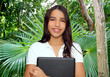 Photo : brunette teen student indian latin holding laptop brunette teen student indian latin holding laptop