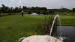 Golf player teeing off on a beautiful golf course