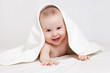Photo: Happy baby under white blanket Happy baby under white blanket