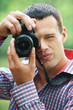 young man taking photos young man taking photos