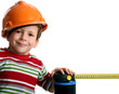 Photo: Adorable future architect in helmet with rule Adorable future architect in helmet with rule