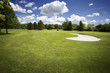 Bunker on golf course and cloudy sky