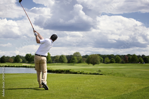 Photo: Golfer teeing off Golfer teeing off