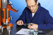Engineer measuring with caliper