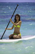 young woman on a standup paddle board