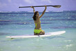 young woman on a standup paddle board