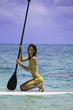 young woman on a standup paddle board