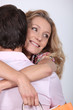 Happy woman hugging her husband