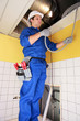 Electrician wiring a building