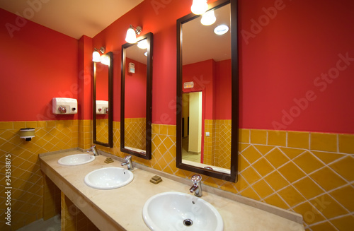 Photo: Interior of toilet with few sinks i Interior of toilet with few sinks i