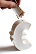 Geld sparen in einer Euro Spardose Geld sparen in einer Euro Spardose