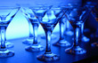Wineglasses arranged in rows on the table in blue light Wineglasses arranged in rows on the table in blue light