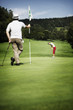 Two golfer on green